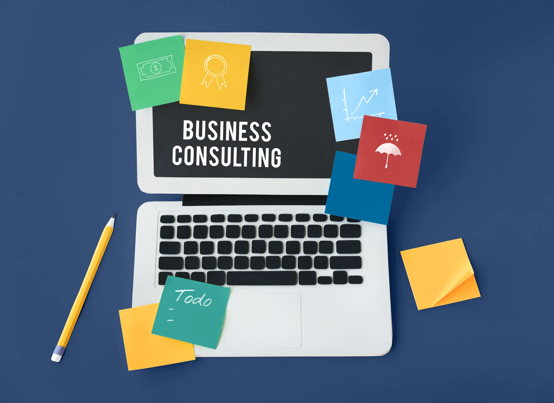 A business consulting workspace with a laptop and planning notes